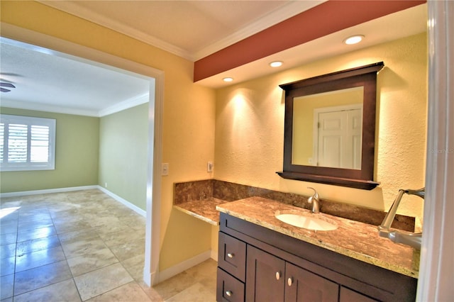 bathroom with crown molding and vanity