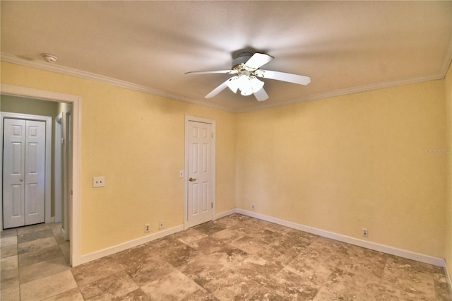 unfurnished room featuring ceiling fan and ornamental molding