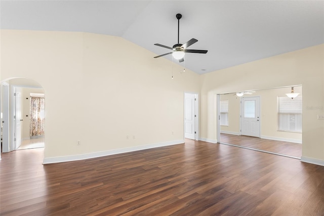 unfurnished living room with high vaulted ceiling, ceiling fan, and dark hardwood / wood-style floors