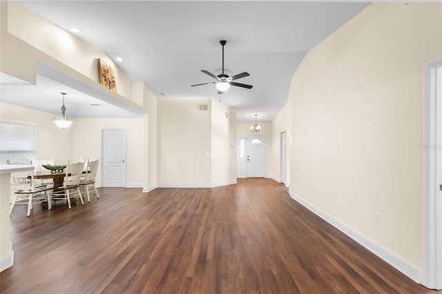 unfurnished living room featuring ceiling fan and dark hardwood / wood-style floors