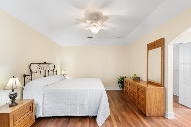 bedroom with dark wood-type flooring and ceiling fan