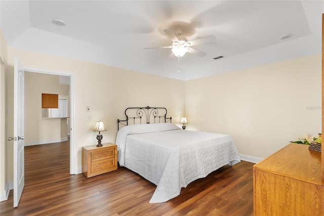 bedroom featuring ceiling fan and dark hardwood / wood-style flooring