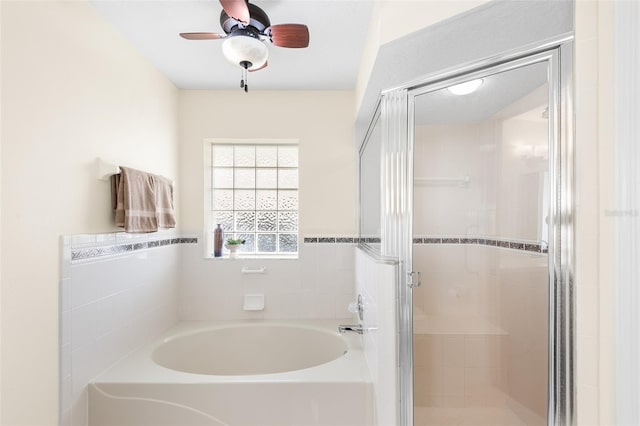 bathroom with shower with separate bathtub and ceiling fan