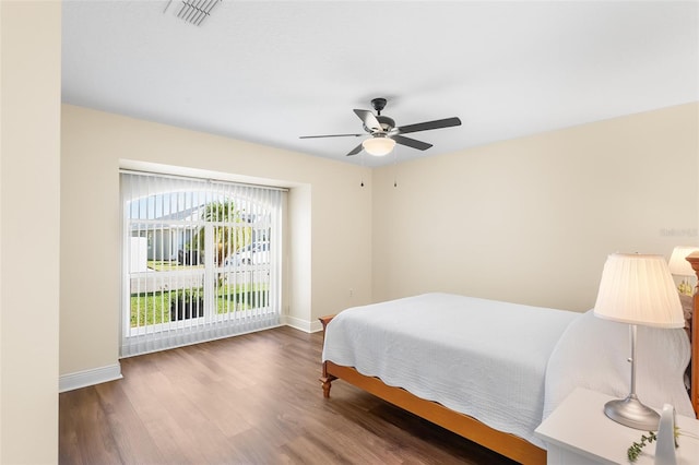 bedroom featuring dark wood-type flooring and ceiling fan