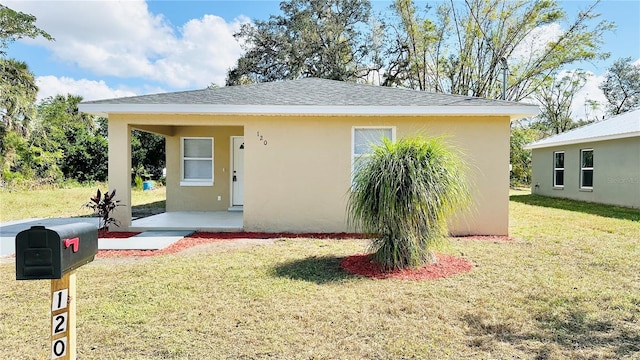 bungalow with a front yard