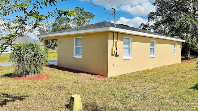 view of side of home featuring a yard