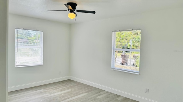 unfurnished room with light hardwood / wood-style flooring and ceiling fan