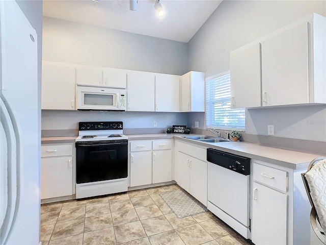 kitchen featuring sink, white appliances, white cabinets, and light tile patterned floors