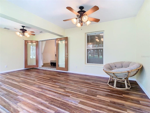 unfurnished room featuring ceiling fan and hardwood / wood-style floors