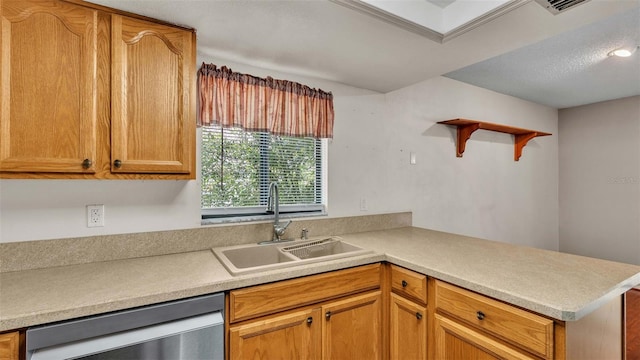 kitchen featuring kitchen peninsula, dishwasher, and sink