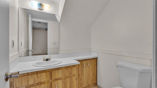 bathroom with toilet and vanity