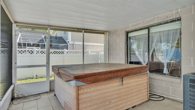 sunroom / solarium featuring a wealth of natural light and wooden ceiling