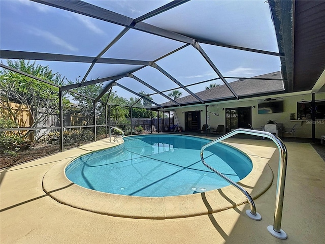 pool featuring a patio, a fenced backyard, and a lanai