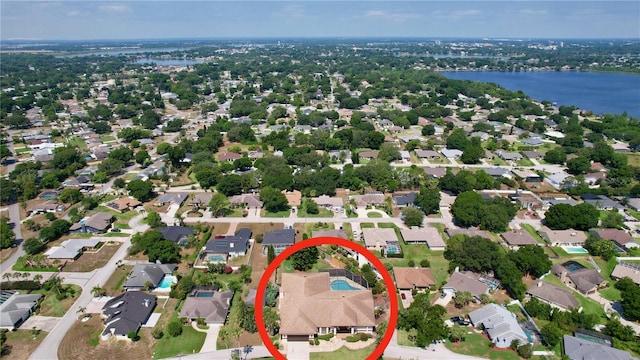 bird's eye view featuring a water view and a residential view