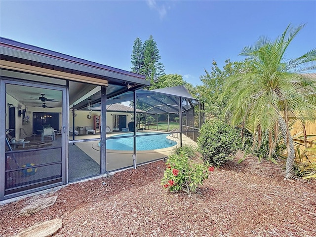 pool with a lanai and a patio