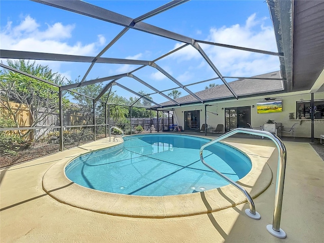 view of swimming pool featuring a lanai, a patio area, a fenced backyard, and a fenced in pool