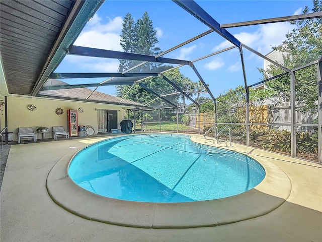 pool with a lanai and a patio