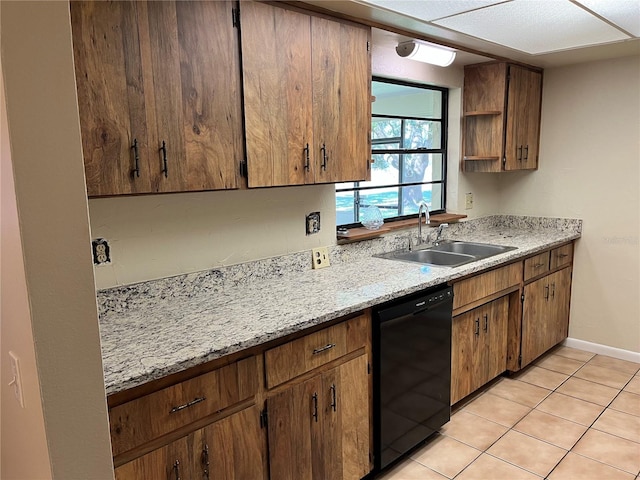 kitchen with sink, dishwasher, light tile patterned flooring, and light stone counters