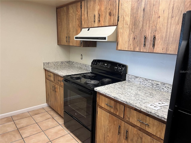 kitchen with black appliances and light tile patterned floors