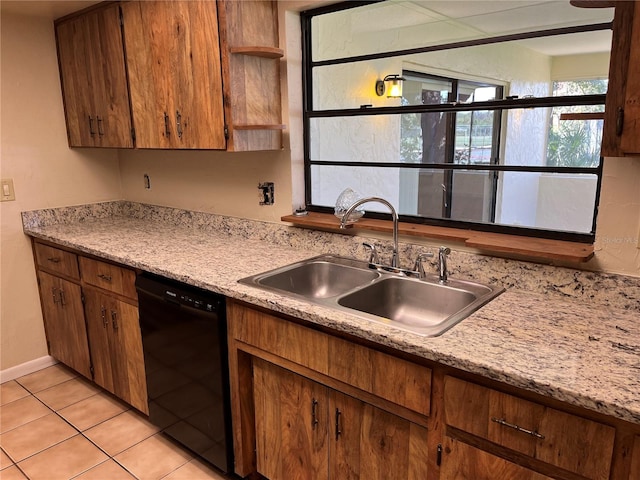 kitchen with dishwasher, sink, and light tile patterned floors