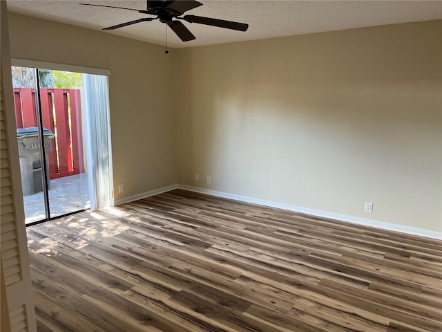 unfurnished room with ceiling fan, a textured ceiling, and hardwood / wood-style floors