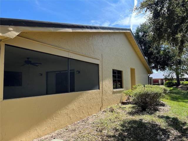 view of property exterior with ceiling fan