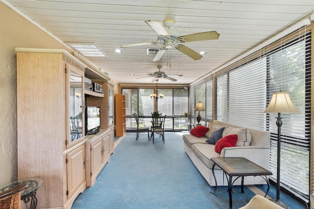 sunroom featuring wood ceiling and ceiling fan with notable chandelier