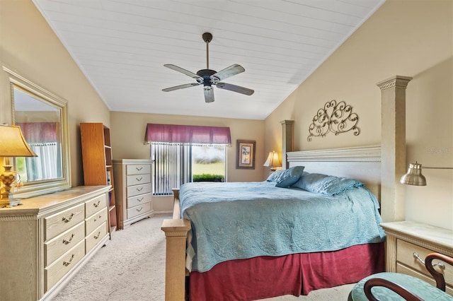 carpeted bedroom with ceiling fan and vaulted ceiling