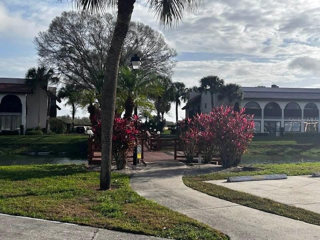 surrounding community featuring a yard