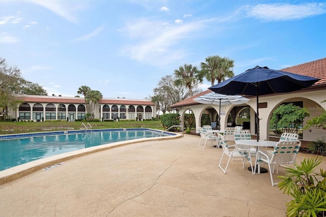 view of pool featuring a patio