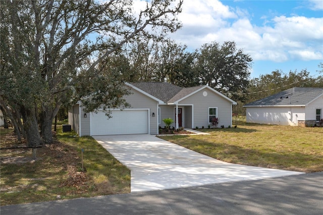 ranch-style house featuring a garage and a front yard