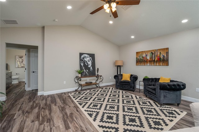 sitting room with ceiling fan, high vaulted ceiling, and dark hardwood / wood-style flooring