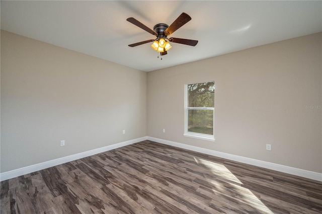 empty room featuring ceiling fan and dark hardwood / wood-style floors