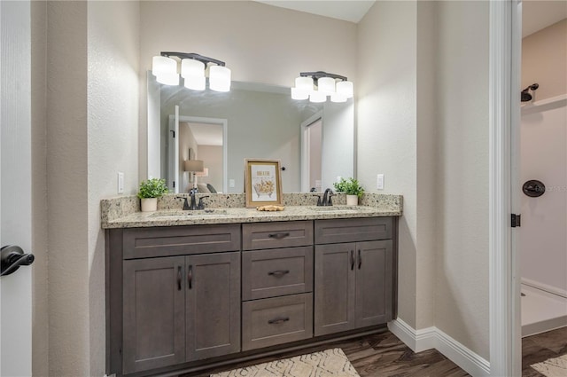 bathroom featuring hardwood / wood-style floors and vanity