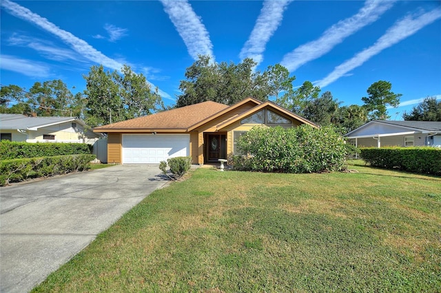 view of front facade with a front lawn and a garage