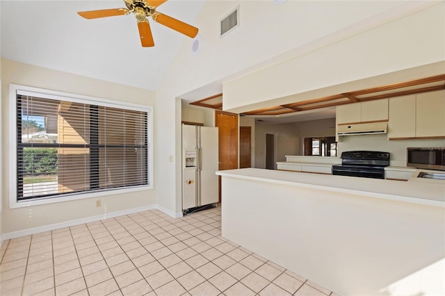 kitchen with cream cabinets, light tile patterned flooring, black electric range oven, white refrigerator with ice dispenser, and ceiling fan