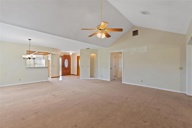 unfurnished living room featuring high vaulted ceiling, light colored carpet, and ceiling fan with notable chandelier