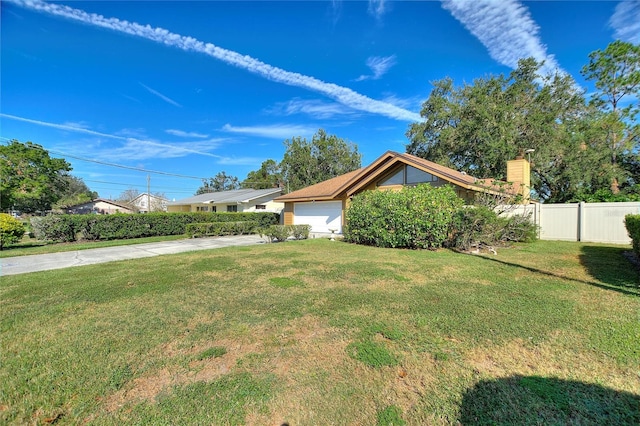 view of side of home featuring a lawn