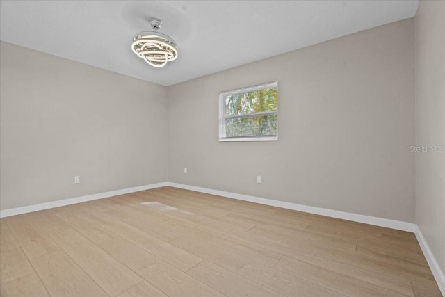 unfurnished room featuring light hardwood / wood-style flooring