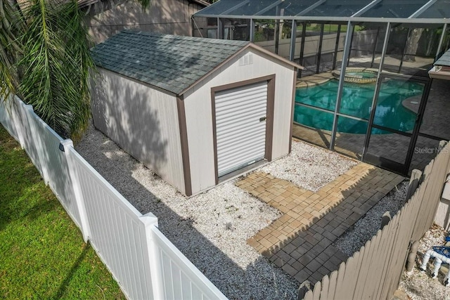 view of outbuilding featuring an in ground hot tub