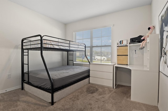 bedroom featuring light carpet