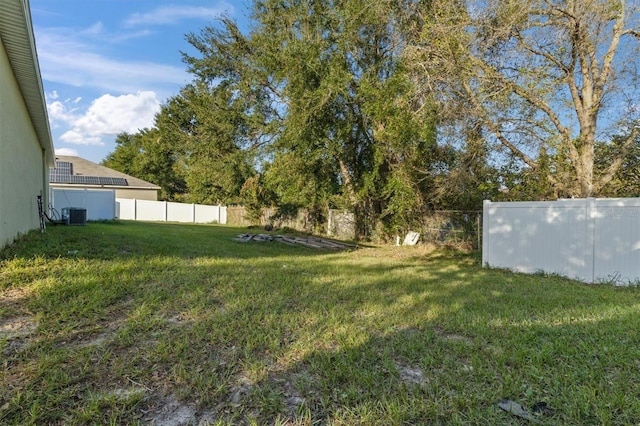 view of yard featuring central AC unit