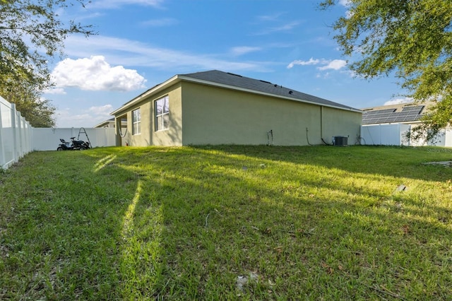 view of property exterior featuring cooling unit and a lawn