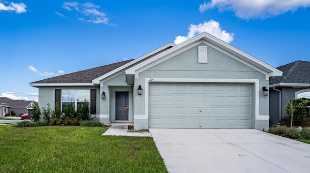 single story home with a front lawn and a garage