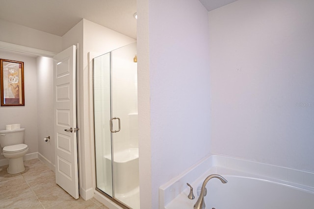 bathroom with tile patterned flooring, toilet, and separate shower and tub