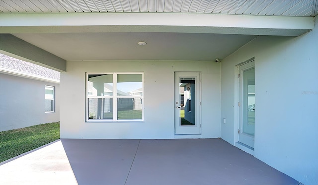 entrance to property with a patio
