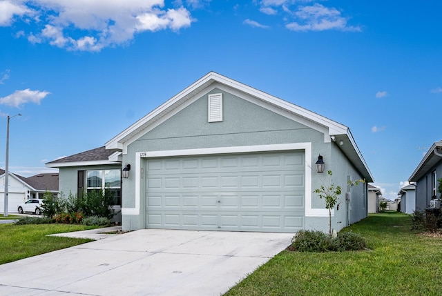 ranch-style house featuring a front yard and a garage