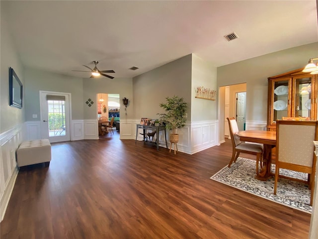 interior space featuring dark wood-type flooring and ceiling fan