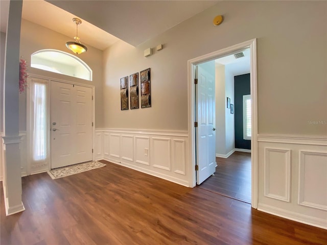 entrance foyer featuring dark hardwood / wood-style flooring