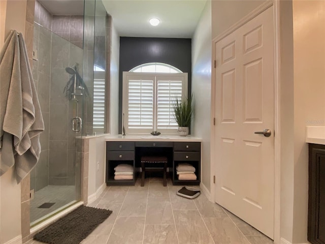 bathroom with vanity and a shower with shower door